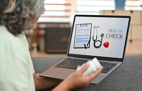 Mature female patient examining or checking her health online on