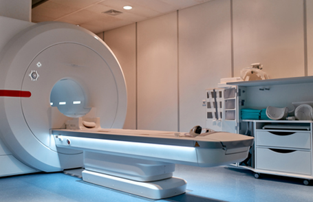 Engineer testing a robotic production simulator in robotics research facility