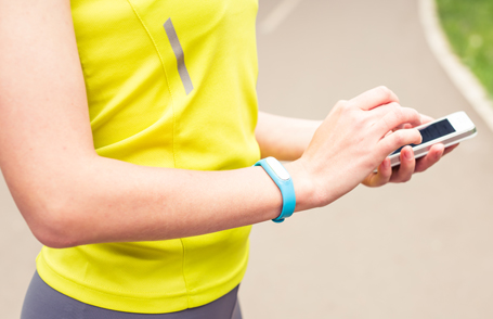 Engineer testing a robotic production simulator in robotics research facility